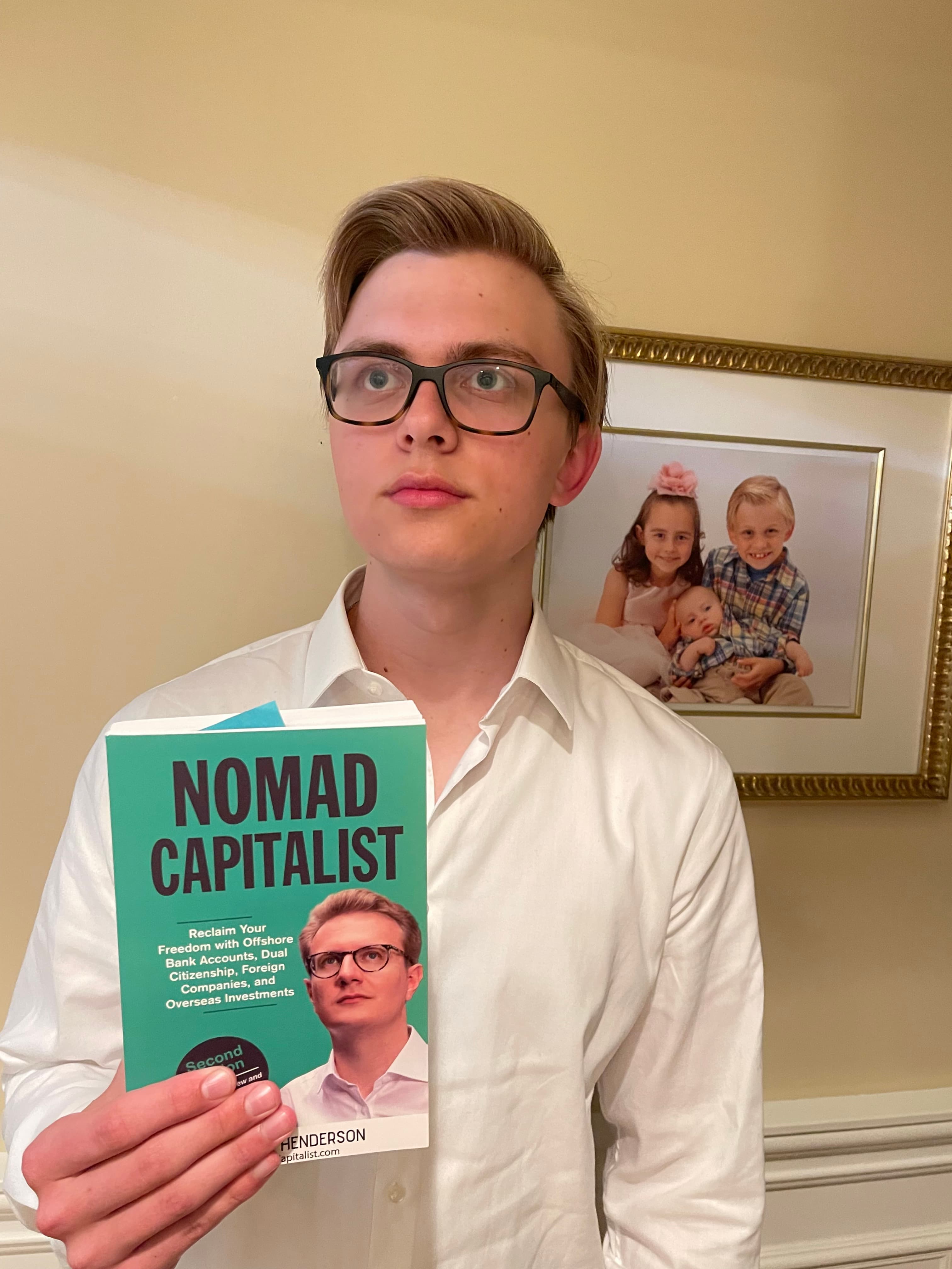 Alexander holding Nomad Capitalist next to a comparison photo